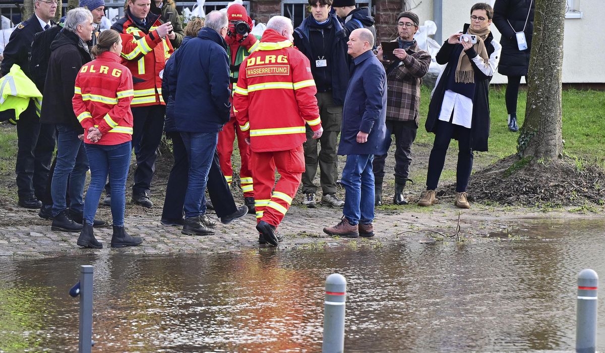 German chancellor tours flooded regions in the northwest, praises authorities and volunteers
